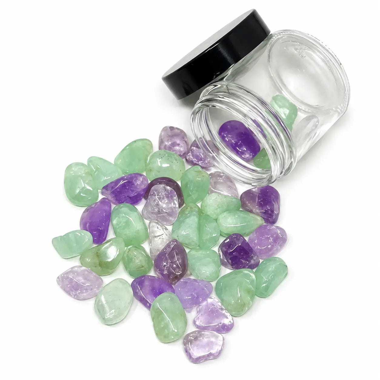 Manifest crystal blend with Amethyst and Prehnite stones spilling from a 4oz glass jar for crystal water bottles