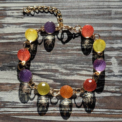 Gumdrop Bracelet with multicolor faceted beads on gold tone adjustable chain, playful charm jewelry.
