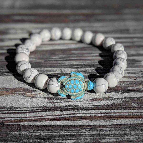 White turquoise turtle bracelet with sea spirit energy on stretch cord.
