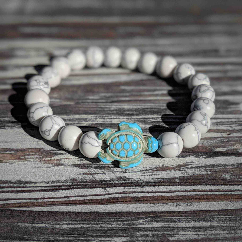 White turquoise turtle bracelet with sea spirit energy on stretch cord.
