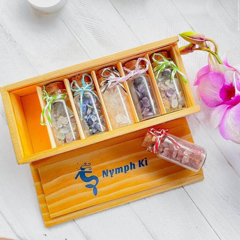Wooden Nymph Ki box with pocket-sized crystal intention jars for healing, meditation, and ritual energy work.
