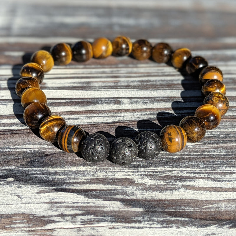  Individual Lava Rock and Tiger’s Eye 8mm bracelets laid flat, uncrossed for contrast.