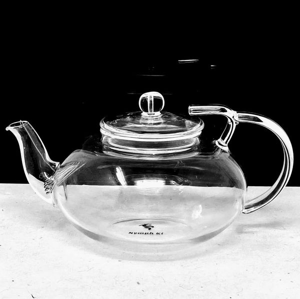 Clear glass tea pot with removable infuser and Nymph Ki logo. - Nymph Ki