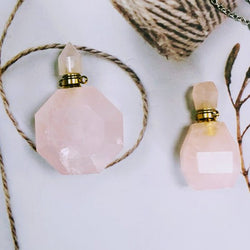 Rose Quartz necklace with essential oil vial and gold-plated chain.