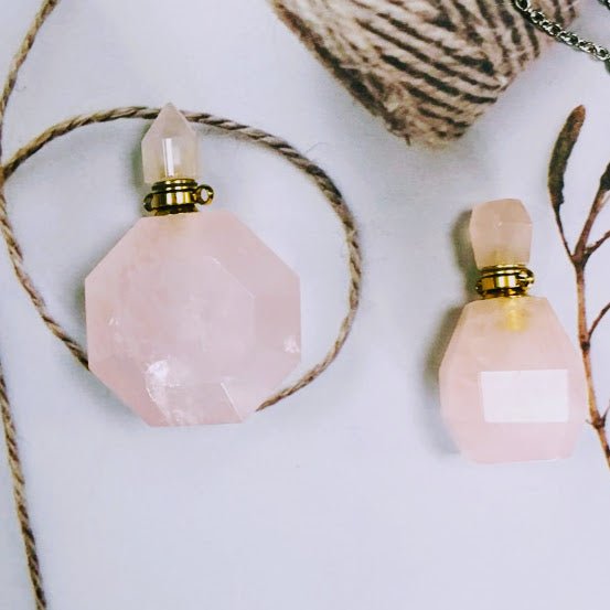 Rose Quartz necklace with essential oil vial and gold-plated chain.
