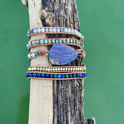 Rainbow Titanium Aura Quartz wrap bracelet with layered beads and shimmer detail.